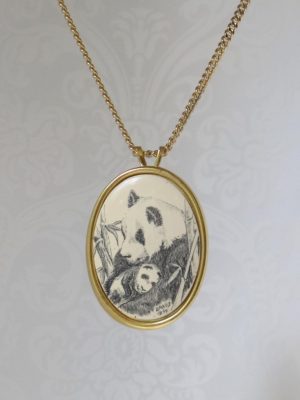 PANDA MOM WITH BABY IN HER ARMS