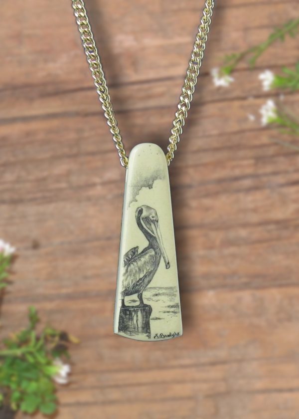 SCRIMSHAWED PELICAN pelican resting on piling