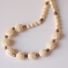 Rose carved beads of ivory