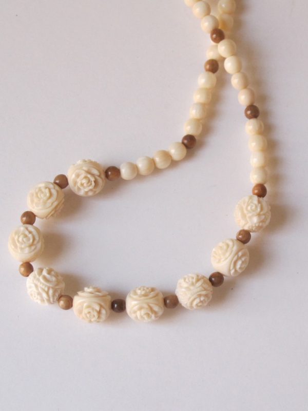 Rose carved beads of ivory