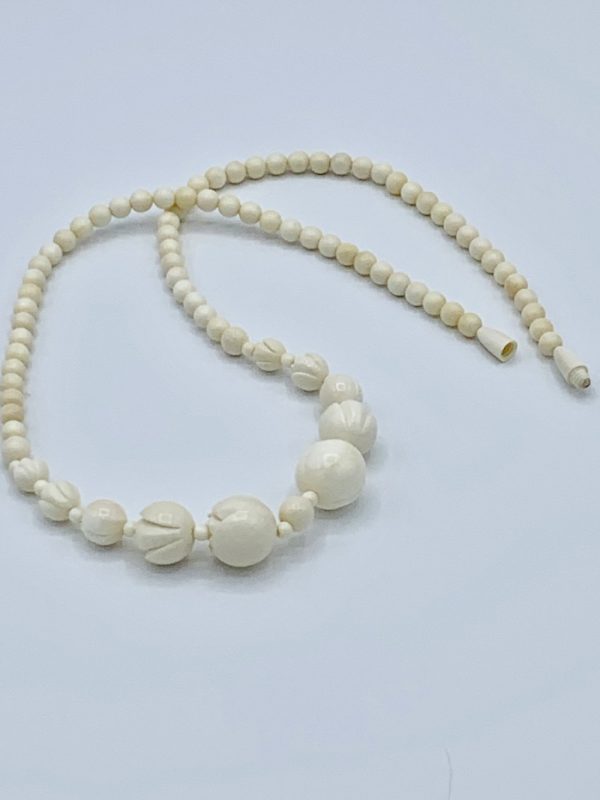 Beads, carved flowers, mammoth ivory