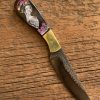 Beautiful etched woman on a buffalo handled custom made patch knife.