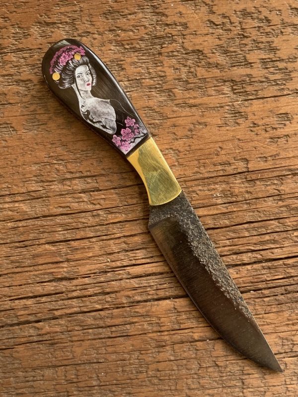 Beautiful etched woman on a buffalo handled custom made patch knife.