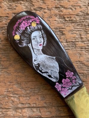 ELEGANT ORIENTAL WOMAN WITH A TATOO