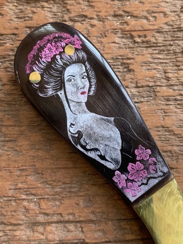 ELEGANT ORIENTAL WOMAN WITH A TATOO